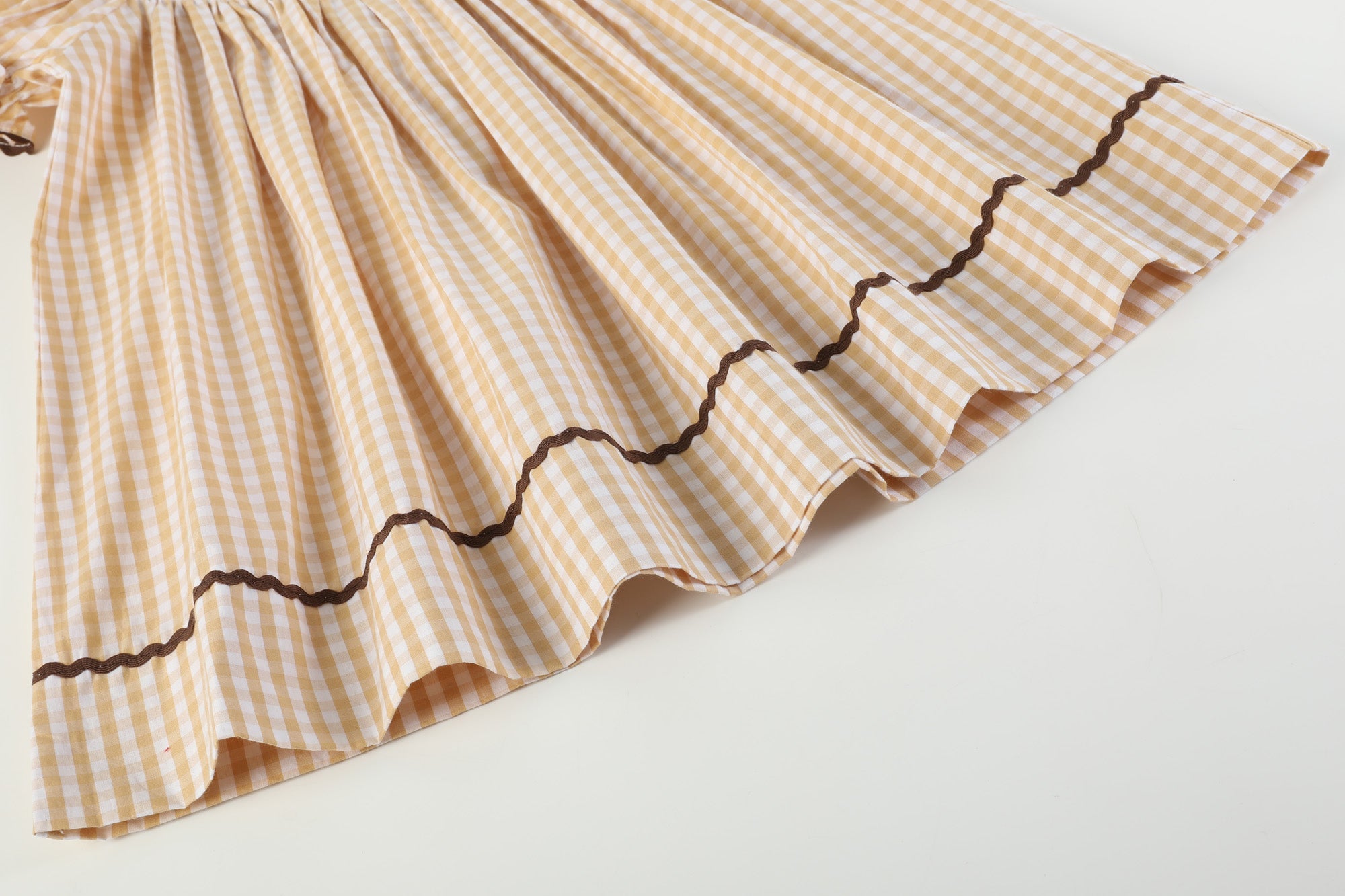 brown gingham smocked dress BROWN GINGHAM SS SMOCK POPLIN MIDI – Sim and Sam main image 1