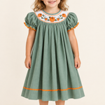Sage Green Pumpkin dress on a three-year-old model